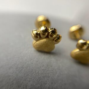 TOPO HUELLA PERRO ORO